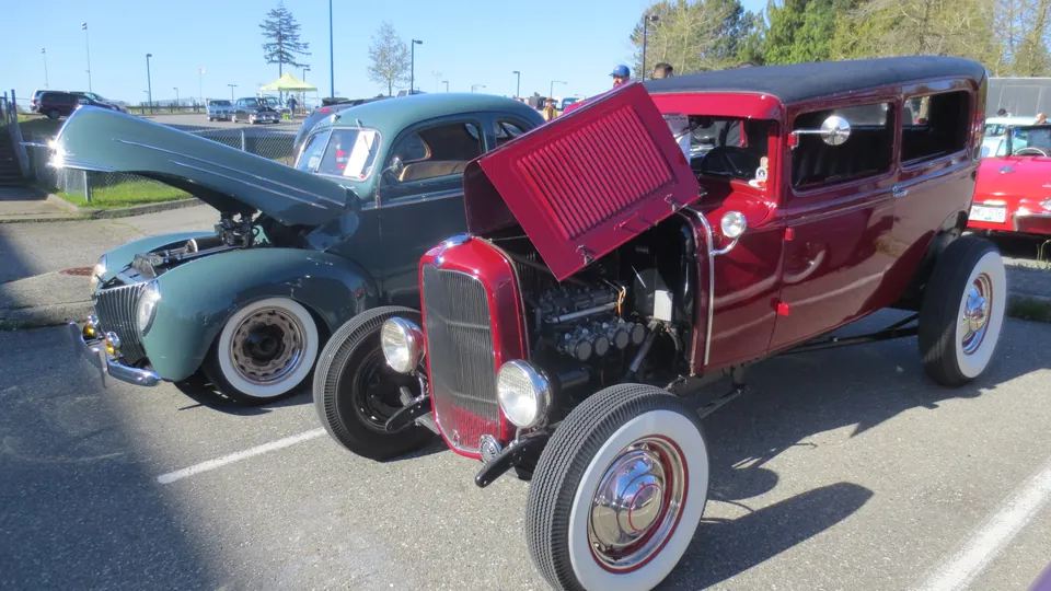 Show-goers admiring classic vehicles at the Country Car Show